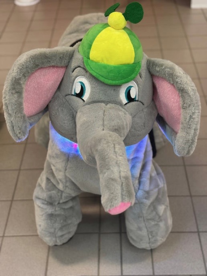 Big Elephant ride-on with a green and yellow cap