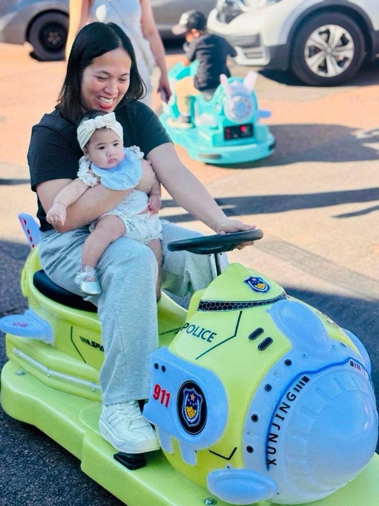 Kid riding a ride-on at an event