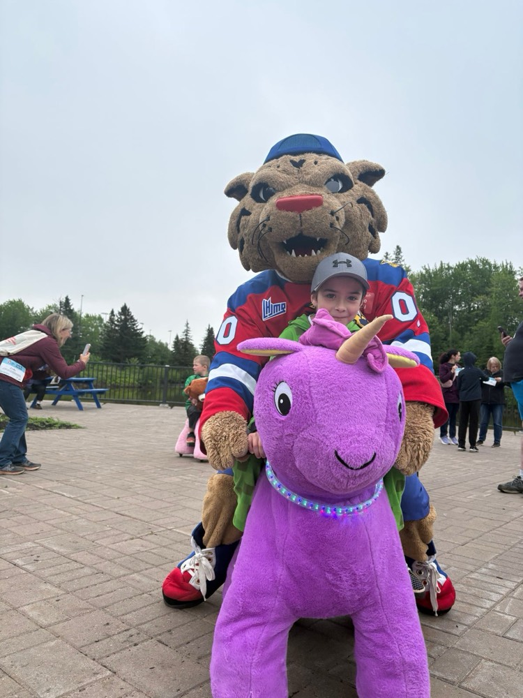 Mascot riding a purple pony
